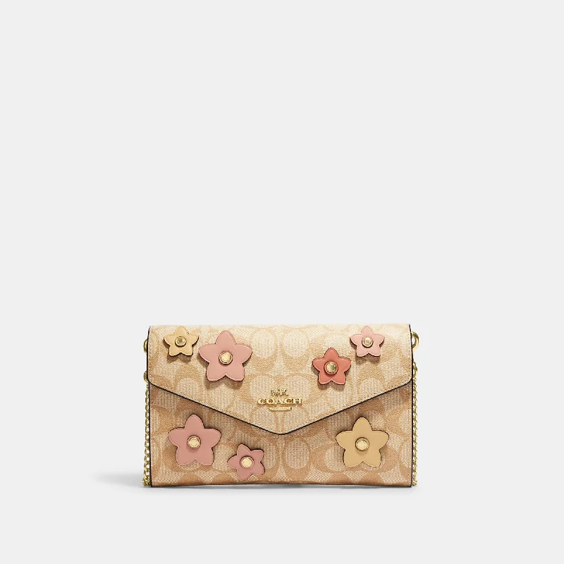 Ladies crossbody bag with leather fringe-Coach Outlet Envelope Clutch Crossbody In Signature Canvas With Floral Applique